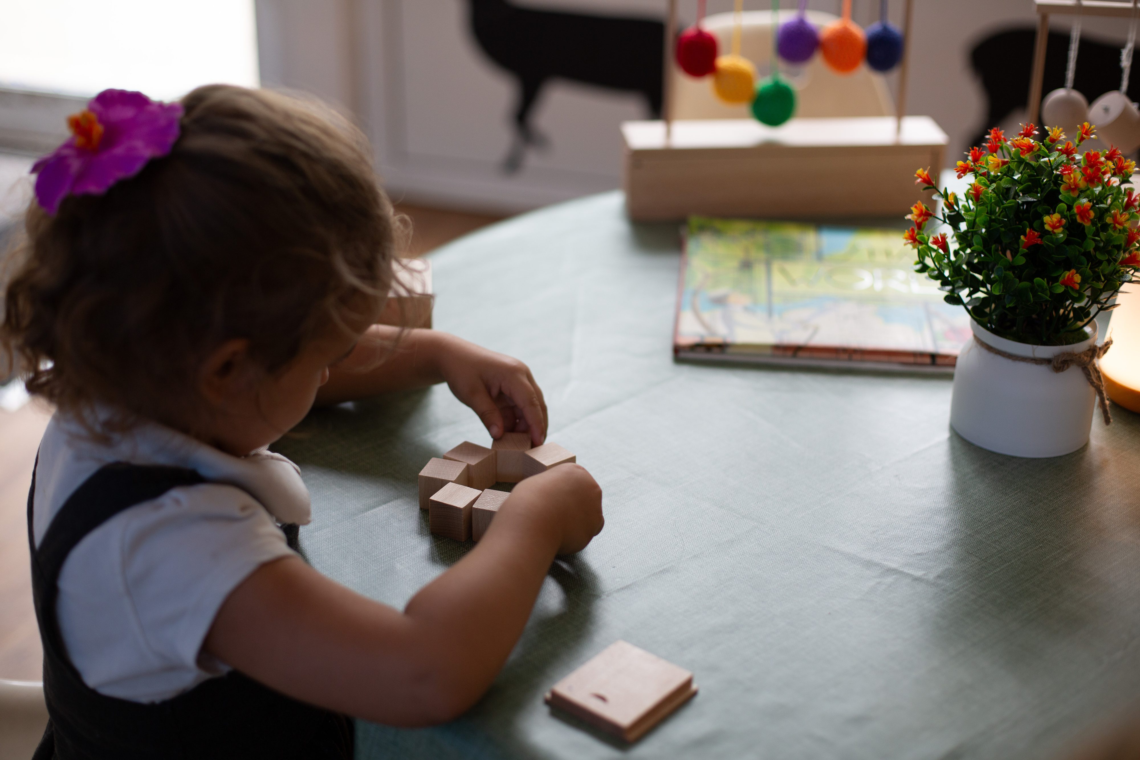 Froebel's Gifts: Child playing with blocks