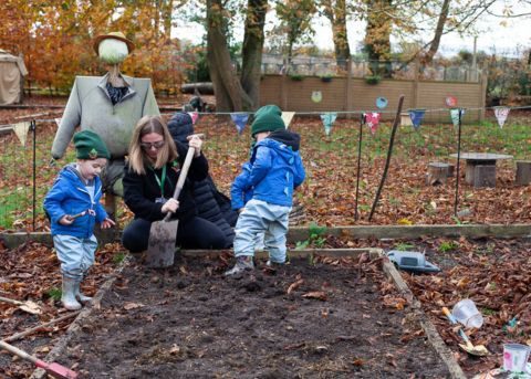 Children and educator playing outside