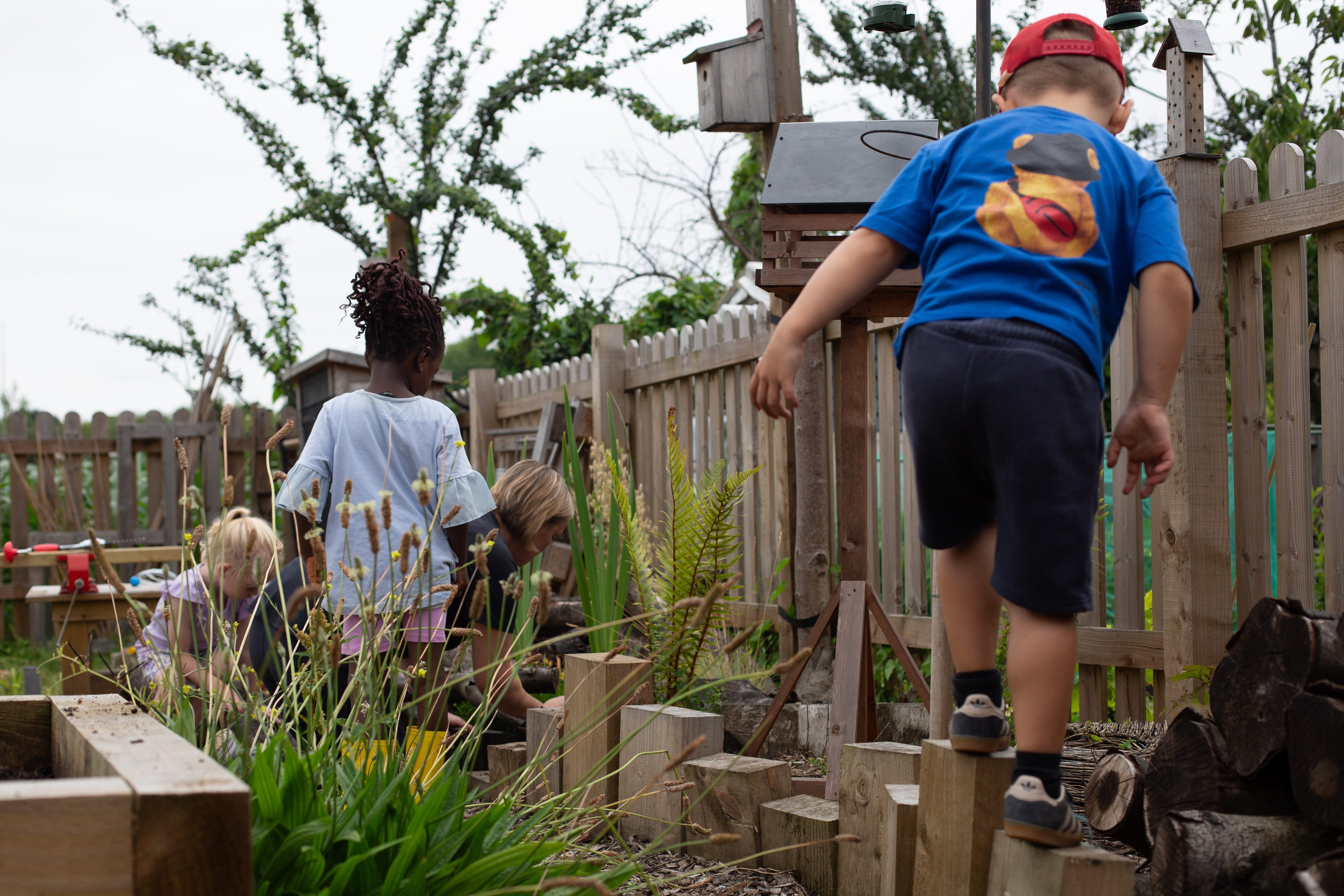 Children playing outside in the garden