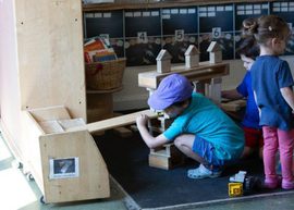 Children playing with wooden shapes