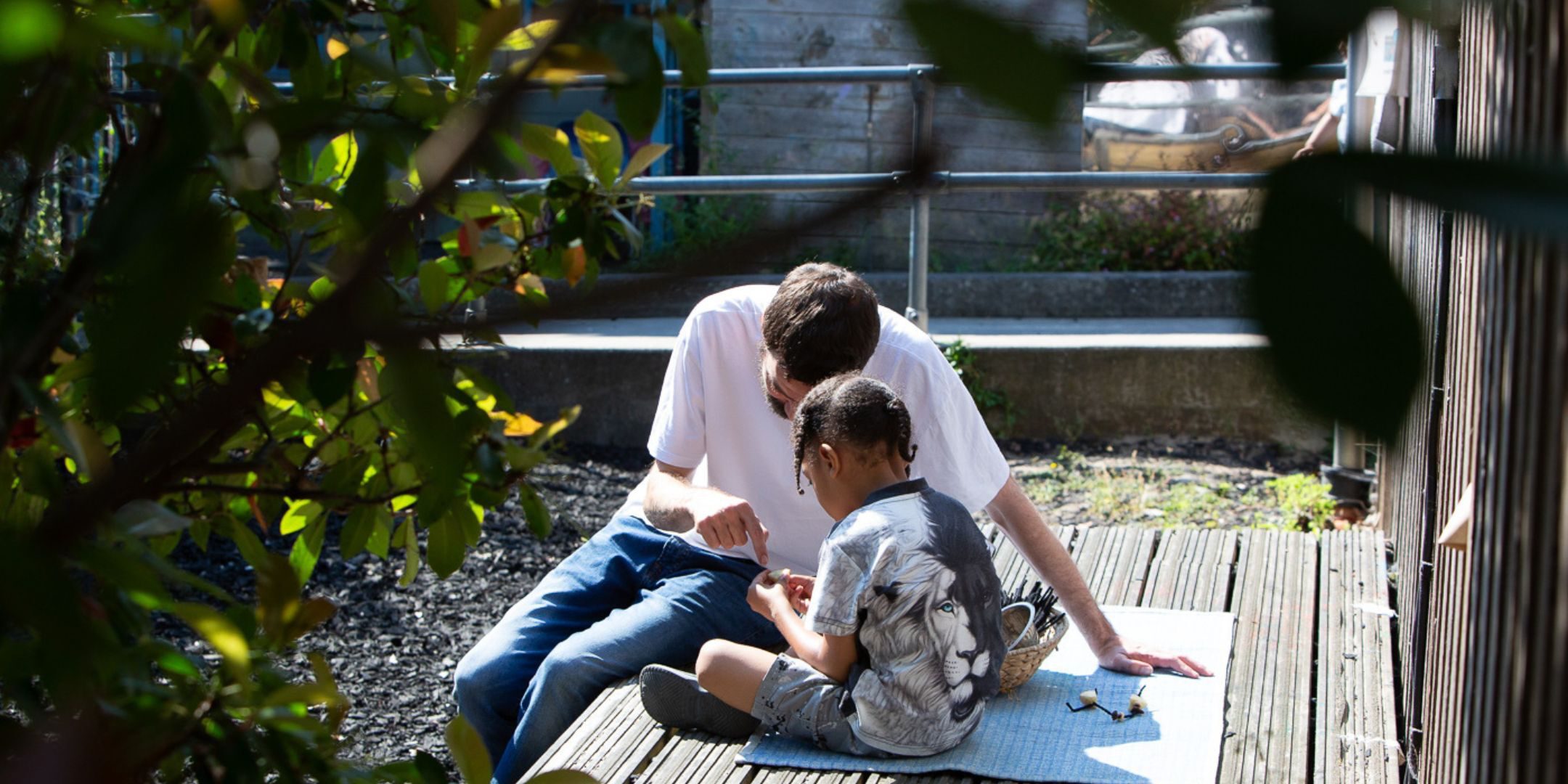 Educator sitting with child